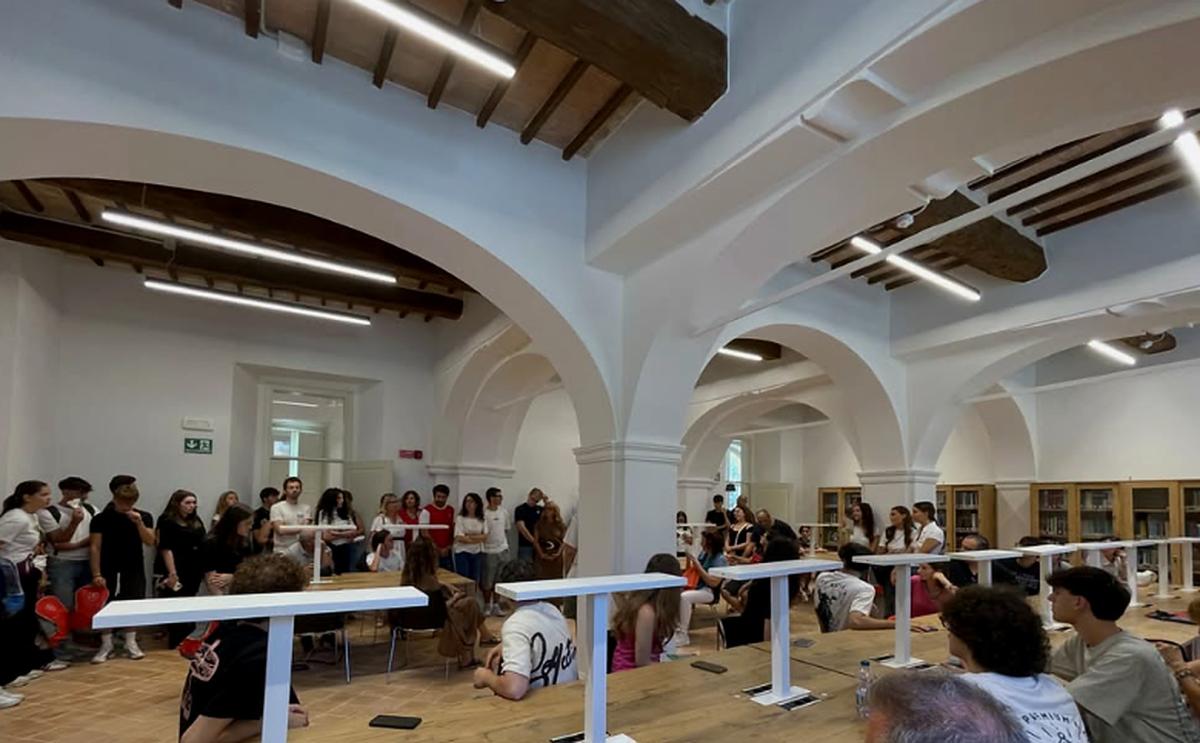 Members of the university community gathered in a shared study space